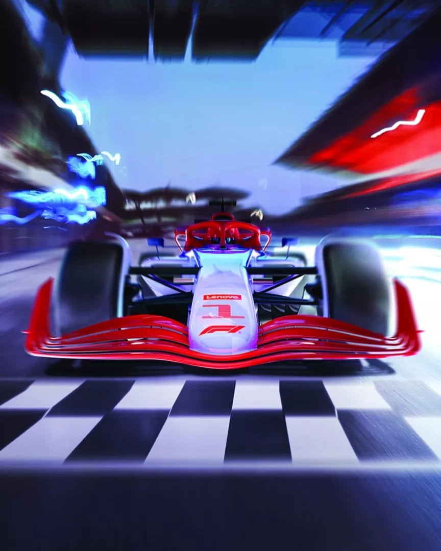 Formula racing car with red and white livery racing through illuminated tunnel with blue overhead lighting